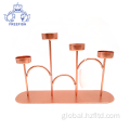 China Rose Gold Metal 4 Arm Candlestick Holder Set Supplier